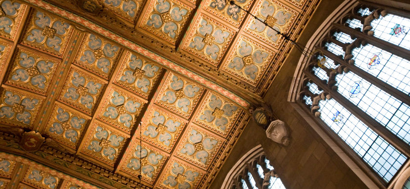 A low angle view of a vaulted ceiling