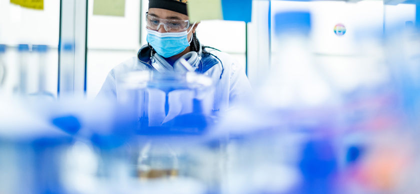 A lab worker analyzes samples