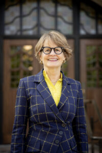 Provost Laurie McCauley standing in front of the Michigan Union.