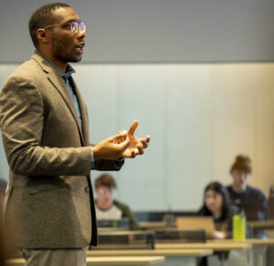 Professor CaVar Reid teaching a history class about the 1960s in the CCCB building, Teacher, Professor