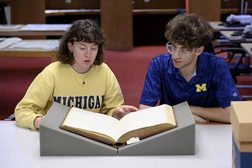 Berkley Sorrells (left) and Jaxson Kaplan-Rudolph (right) interned at the Bentley this past summer, researching and organizing U-M athletics collections
